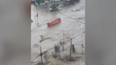 Shipping containers swept away in deadly Philippines floods