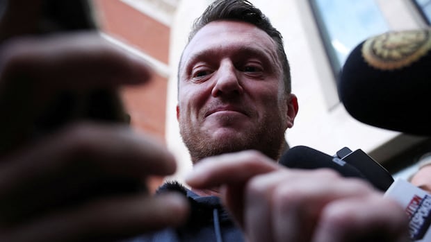 British far-right activist Tommy Robinson cleared of terror charge after not giving police phone access