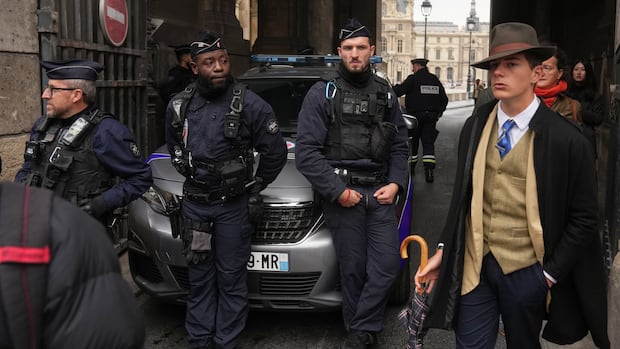 Turns out ‘Fedora Man’ in viral Louvre heist photo isn’t AI — just a French teen with style