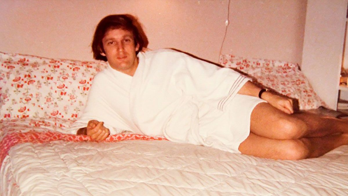 Is this photo of Trump wearing a bathrobe across bed real?