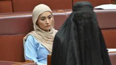 Australia senator suspended after burka stunt in parliament