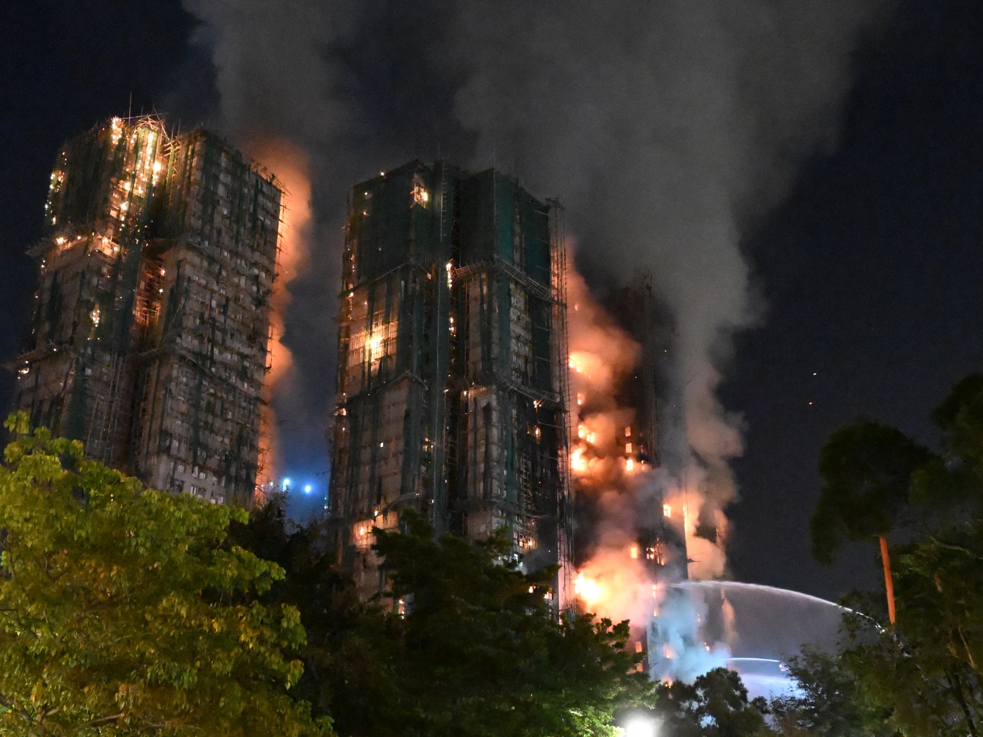 At least 13 dead as fire engulfs Hong Kong high-rise residential buildings