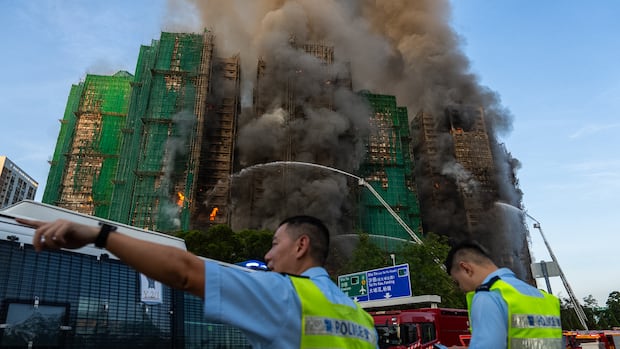 High temperatures hinder Hong Kong firefighters battling deadly highrise complex fire