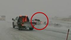 Watch: Car nearly hits first responders in Midwest blizzard conditions
