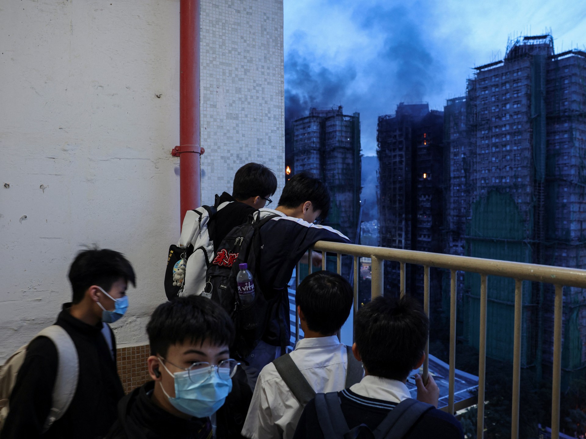 Hong Kong fire that killed dozens ‘under control’; hundreds still missing
