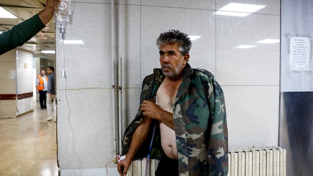 Israeli forces kill at least 13 in southern Syria raid, officials and residents say