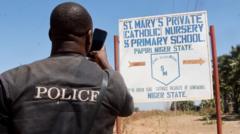 Nigerian villagers ‘too scared to speak’ after hundreds of schoolchildren kidnapped