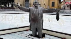 Pavarotti statue frozen knee-deep in ice rink strikes wrong note in Italy