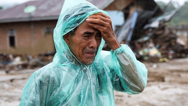 ‘Is she alive?’: Indonesian man’s hopes of finding missing wife fade after flood disaster