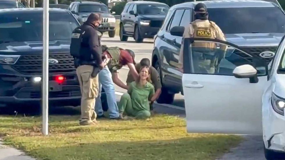 Feds forcibly yank woman in medical scrubs from car as she screams she’s a US citizen