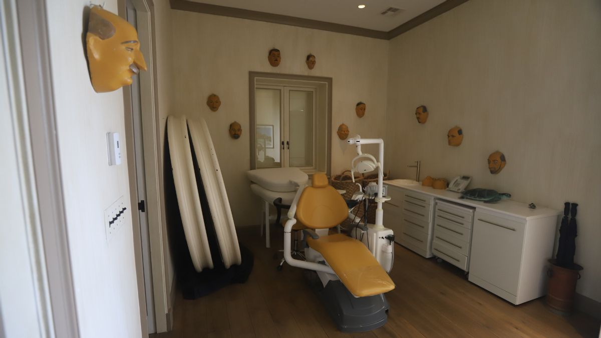 Newly released Epstein island photos include image showing old man masks on walls