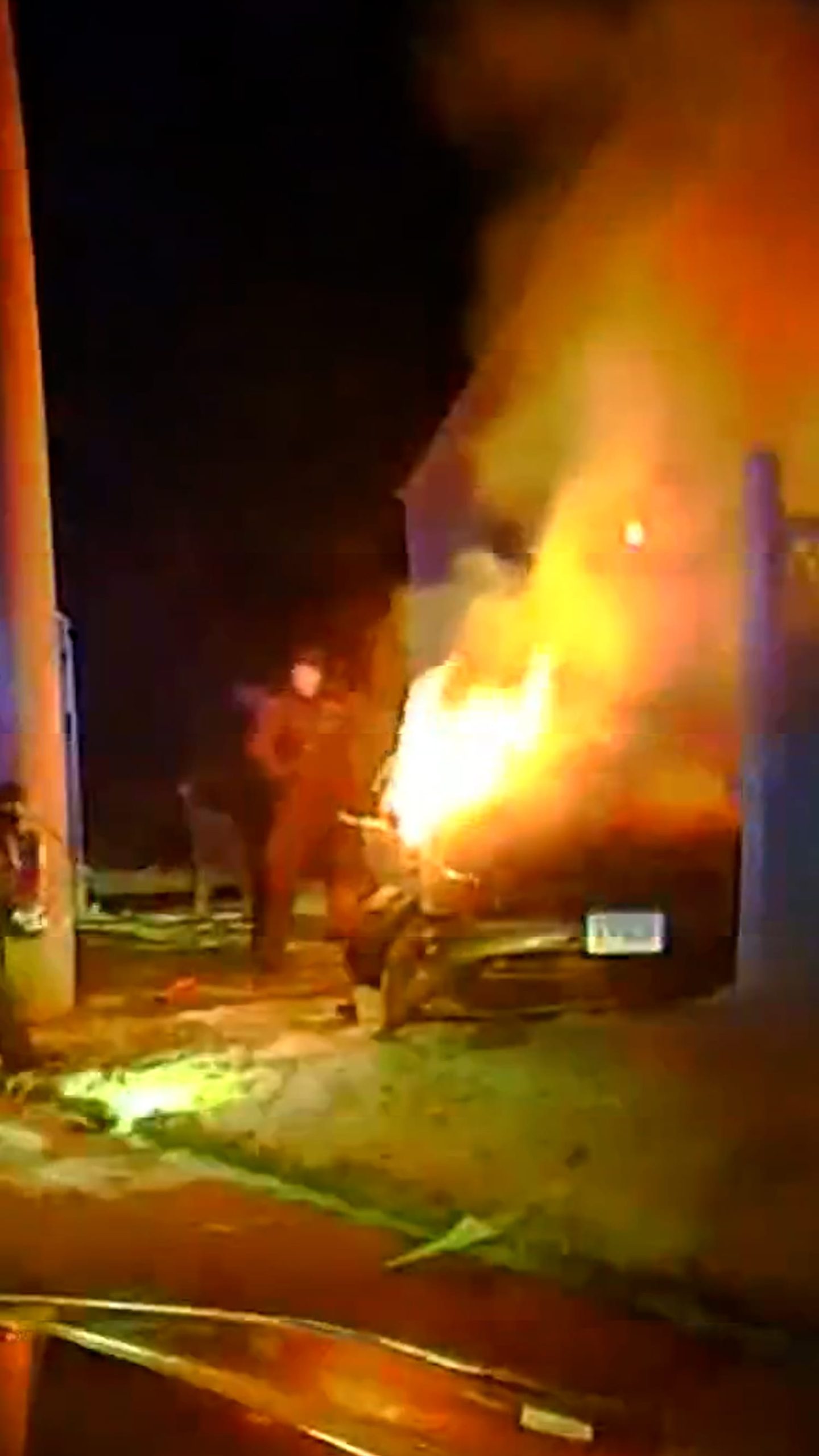 Officers rescue driver from burning vehicle