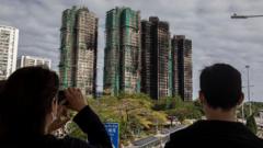 Hong Kong votes in election as city mourns deadly fire