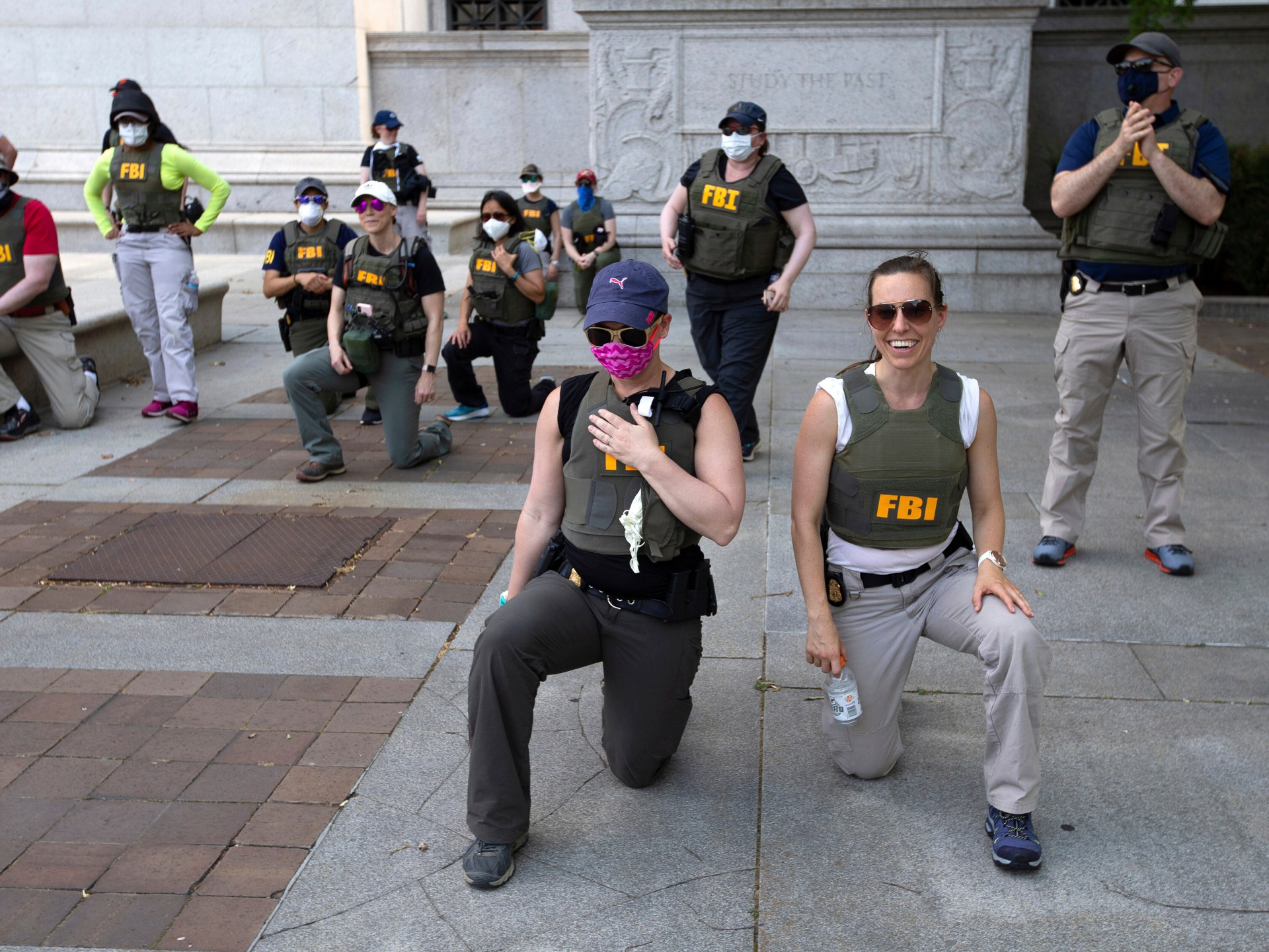 FBI agents allege wrongful termination for kneeling during US protest