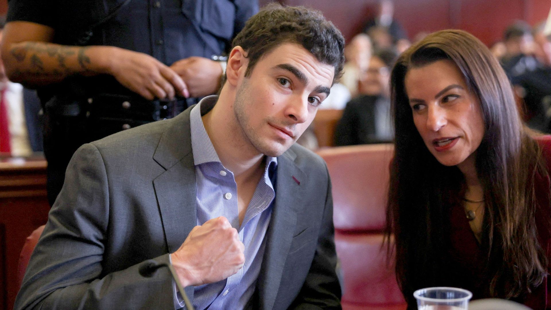 Man charged with killing US healthcare boss had handgun, silencer and ‘manifesto’ in backpack during arrest, police say