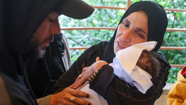 Baby dies of exposure after winter storm floods Gaza tents, medics say