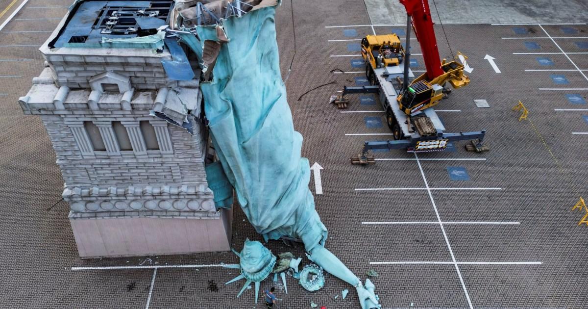 Statue of Liberty replica falls over during major storm in Brazil