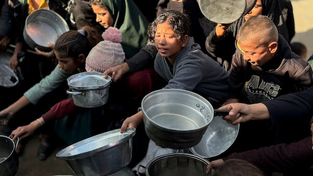 Israel will ban dozens of aid groups from Gaza starting on New Year’s Day