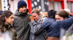 Swiss open criminal case against managers of ski resort bar after deadly fire