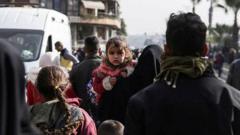 Thousands flee clashes between Syrian government and Kurdish fighters in Aleppo