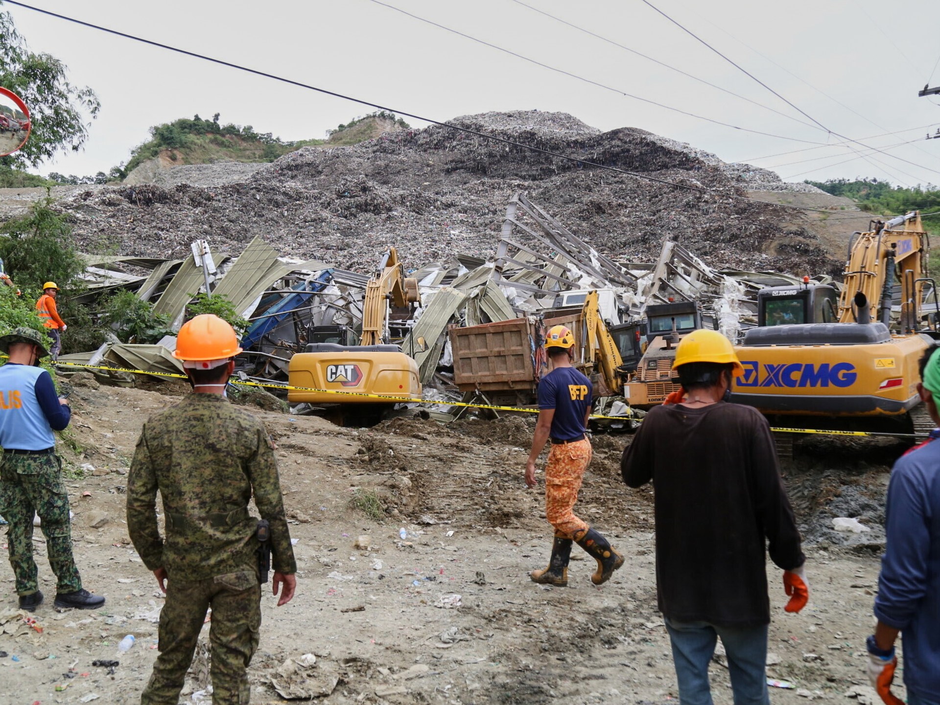 Death toll in Philippines landfill collapse hits 4, dozens still trapped