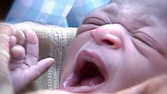‘Miracle baby’ born in a tree above Mozambique floodwaters dies aged 25