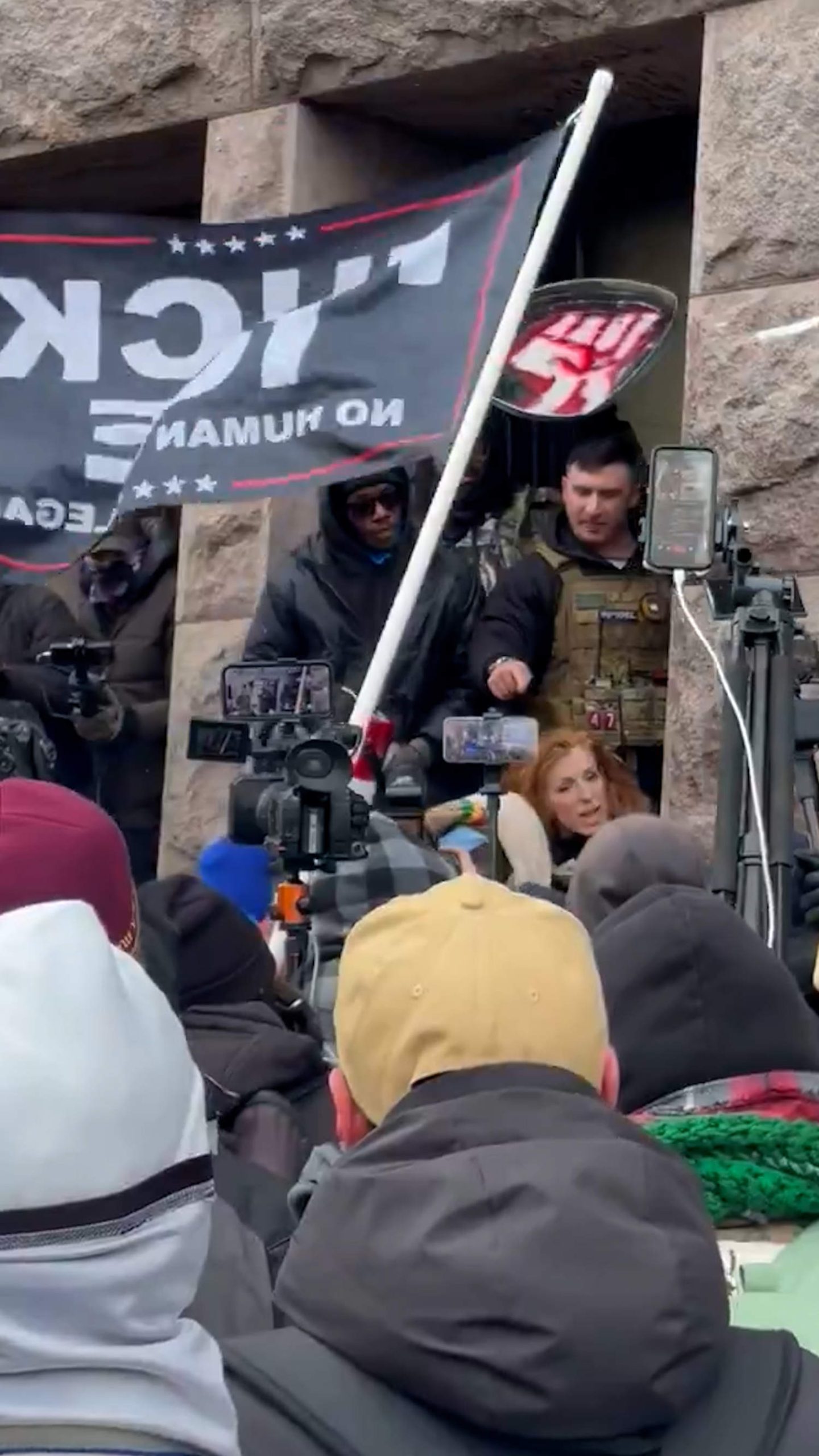 Far-right influencer surrounded by crowd in Minneapolis