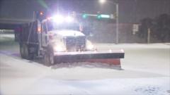 Snow ploughs battle blizzards on roads and runways in Oklahoma