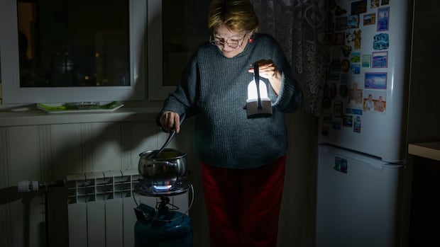 Kyiv residents stranded in tower blocks as Russia targets power system