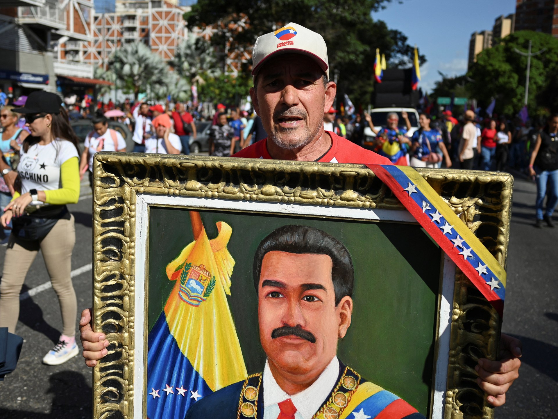 Thousands march in Venezuela to demand US free President Maduro, wife
