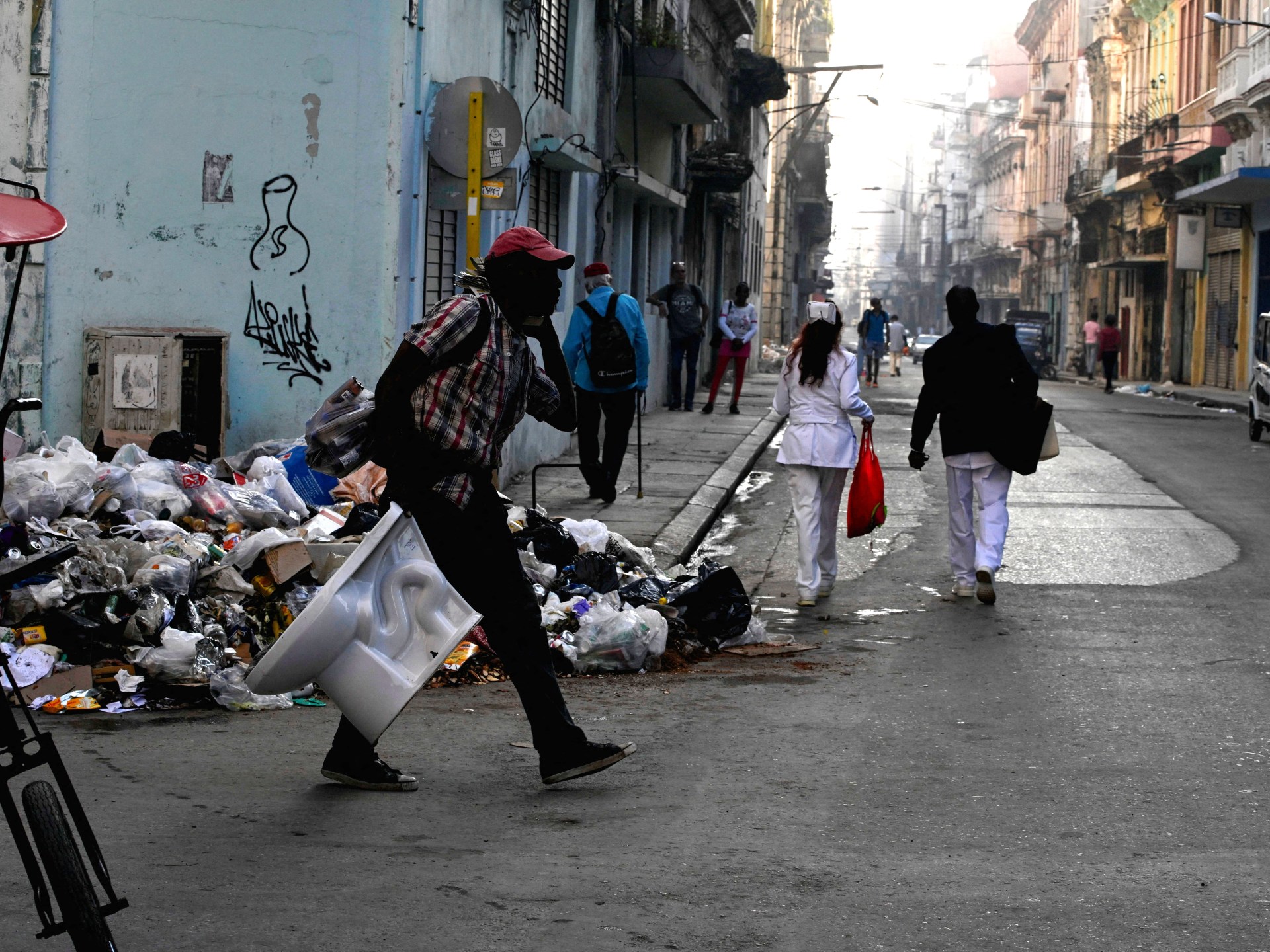 Waste piles up in Cuba as US-imposed fuel blockade halts collection trucks