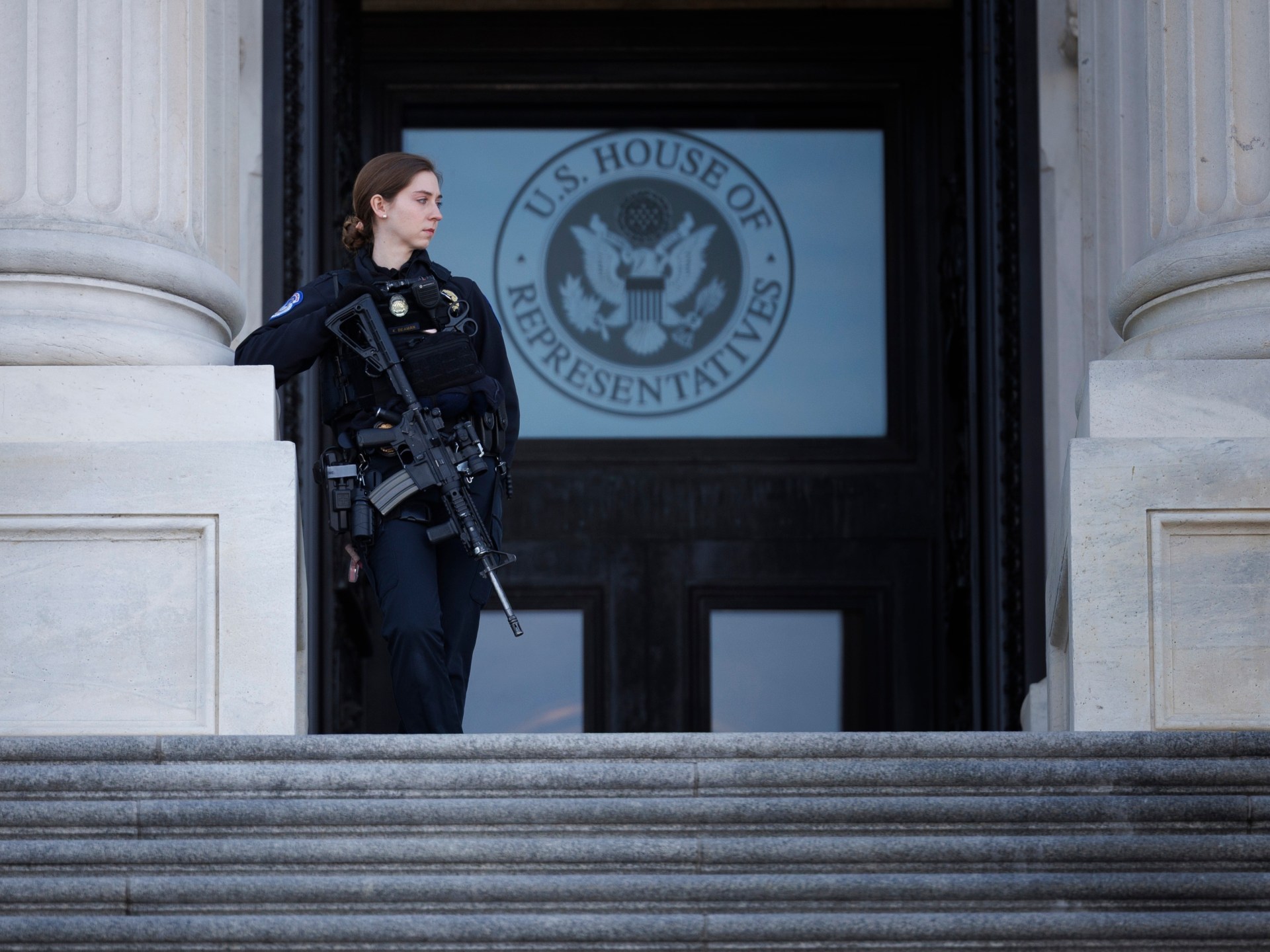 Man with shotgun running towards US Capitol building arrested by police