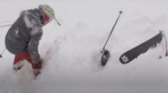 Watch dramatic rescue of skier buried in deep snow