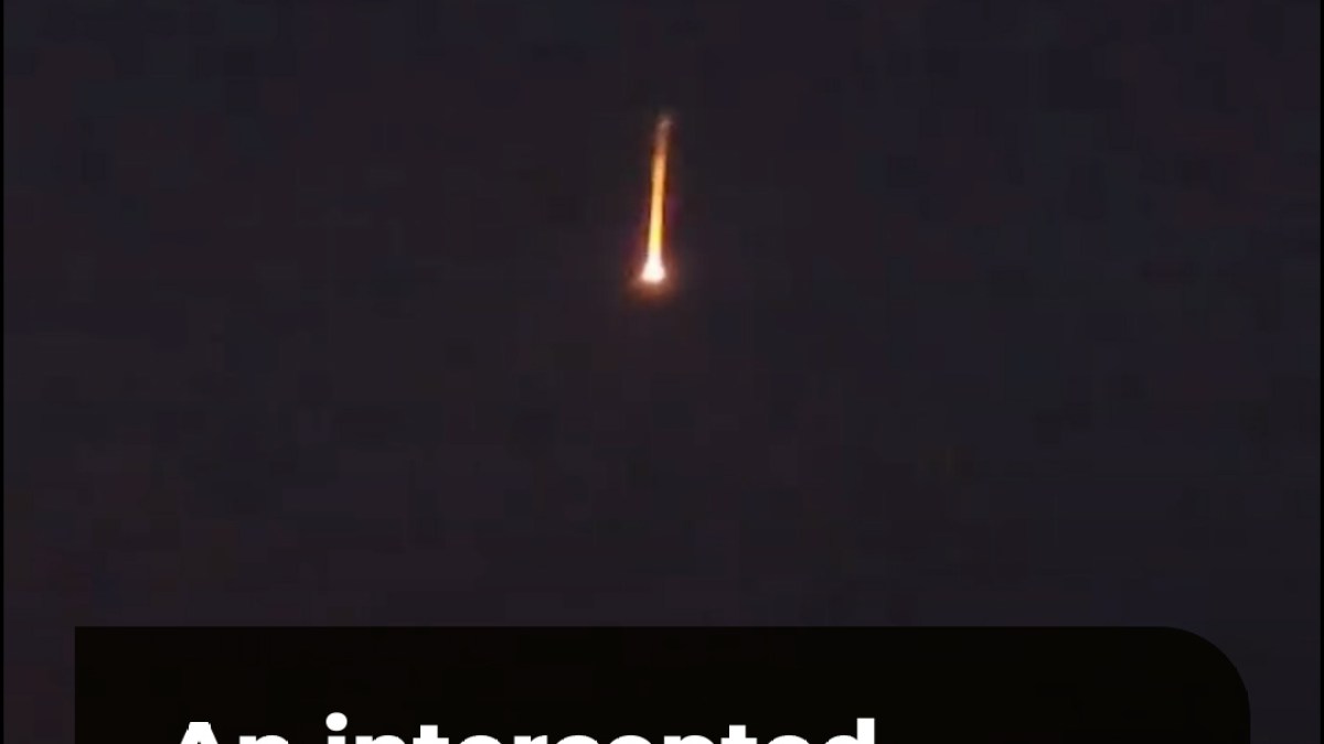 An intercepted drone burns and falls over Erbil in Iraq