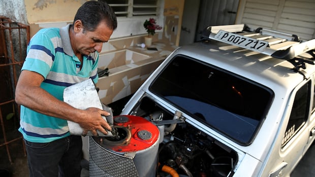 Amid fuel crunch, Cuba mechanic converts car to run on charcoal