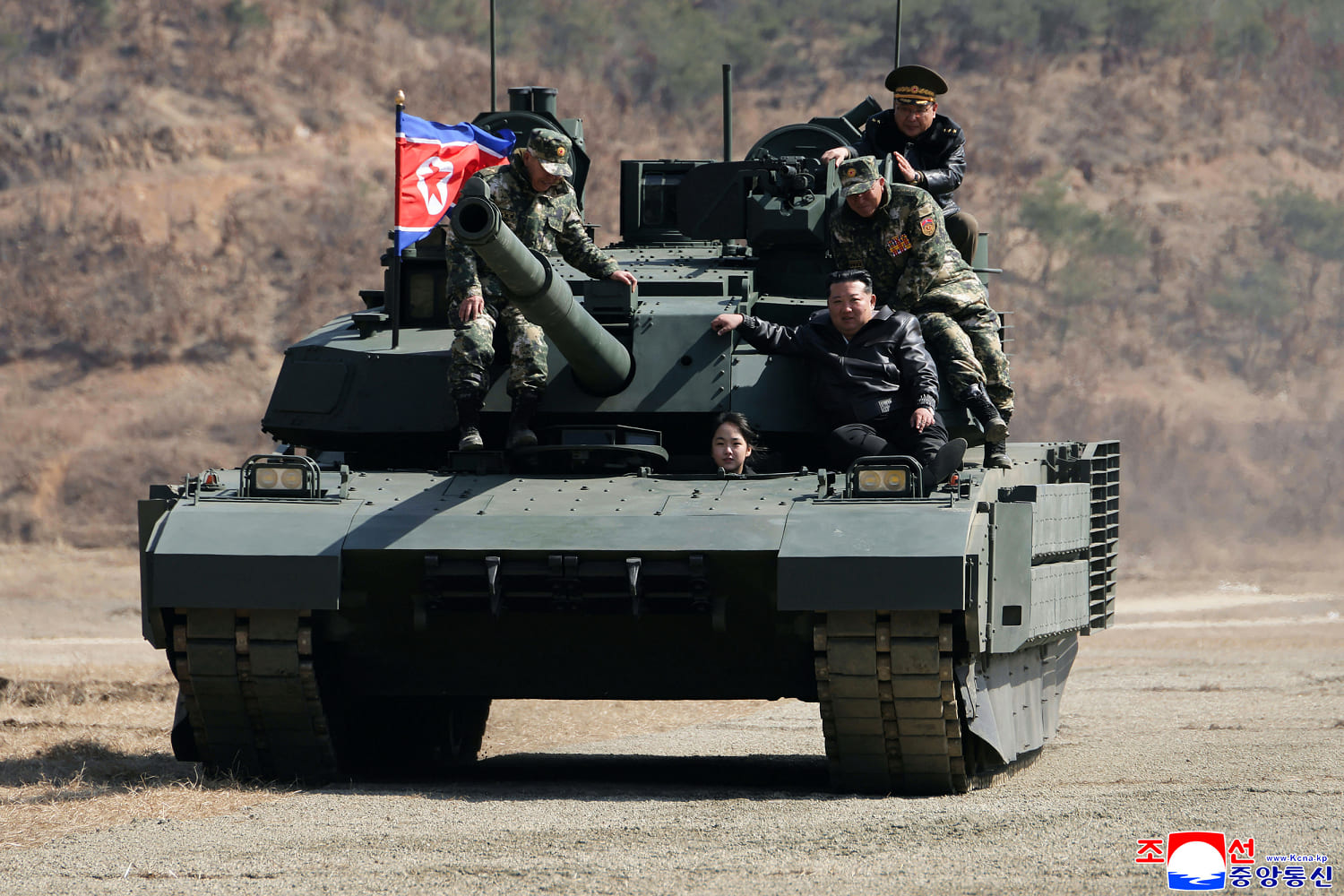 North Korean leader Kim and his daughter ride a tank together during army training
