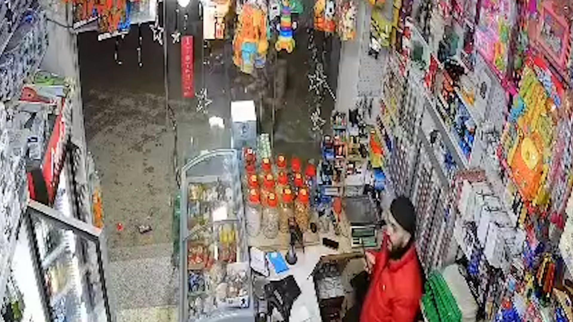 Moment Israeli soldier throws stun grenade at shop near Ramallah