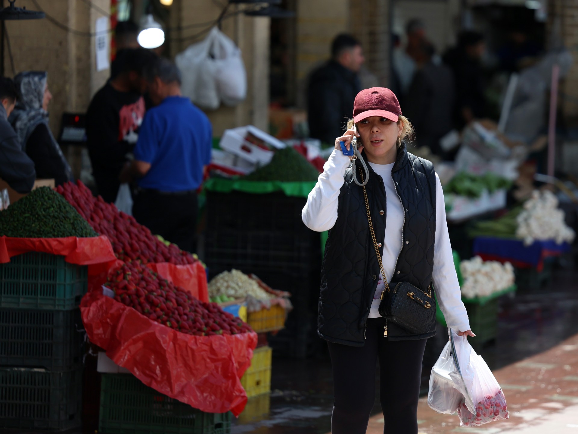 Amid US-Israeli attacks, people in Iran struggle to survive ailing economy