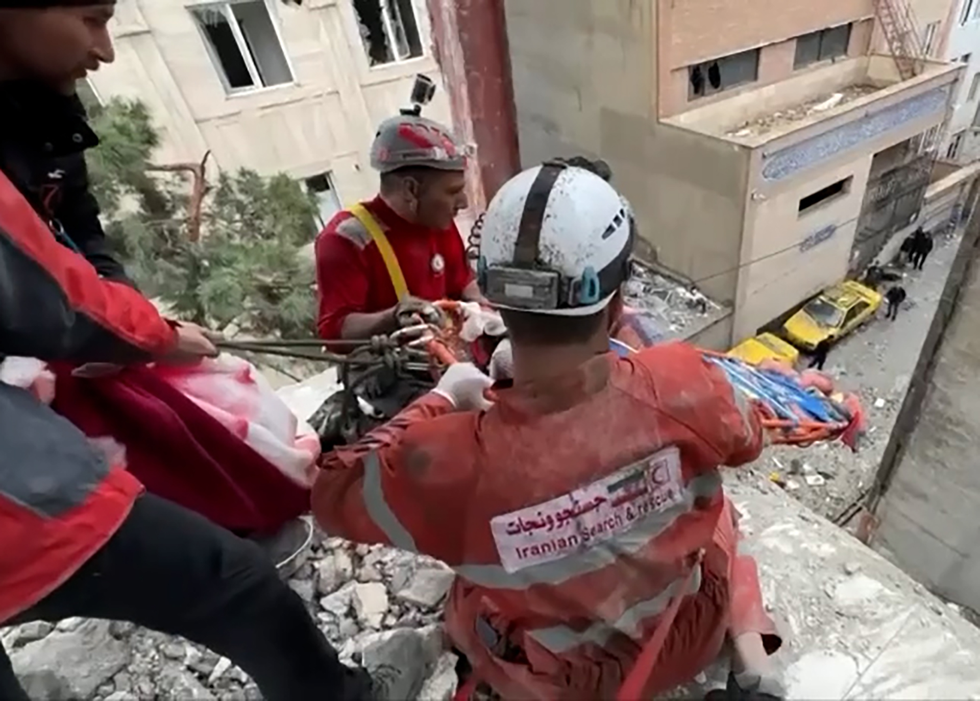 First responders rescue man from Tehran building hit by air strike
