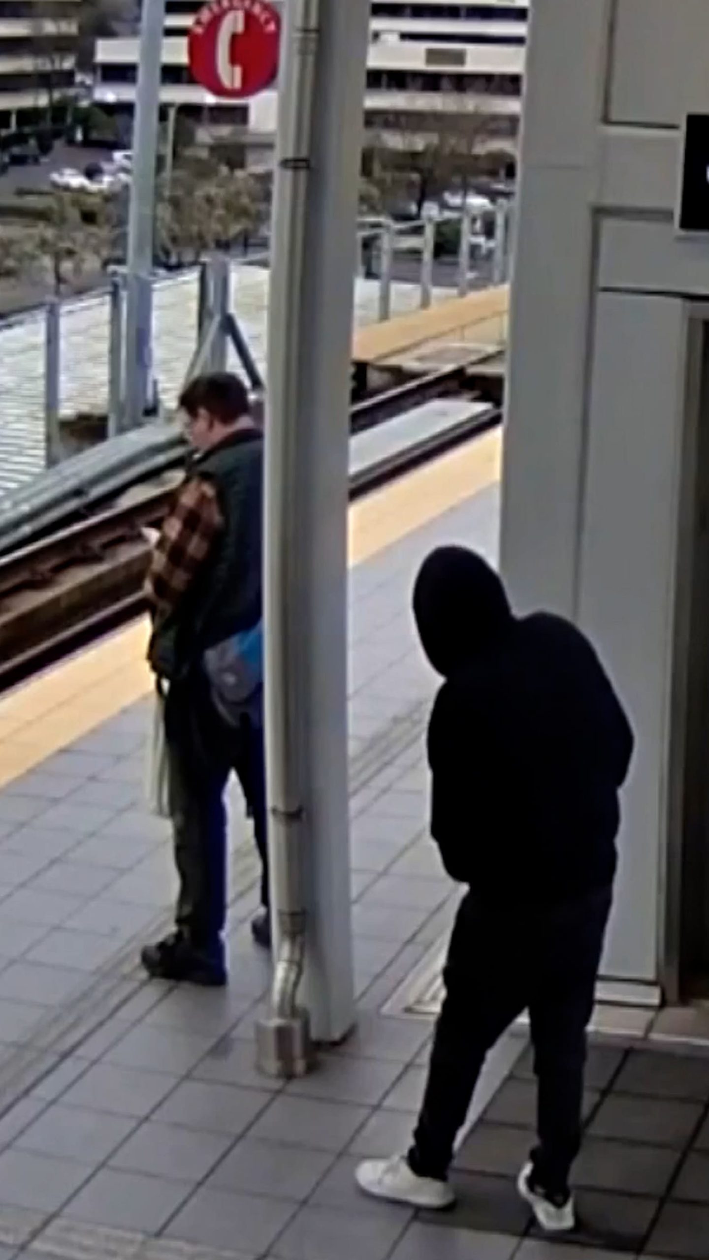 Suspect appears to push man into oncoming train path