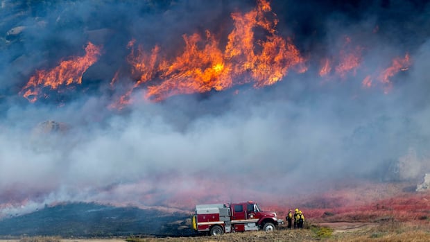 Smoky, fast-moving wildfire triggers evacuation orders in Southern California