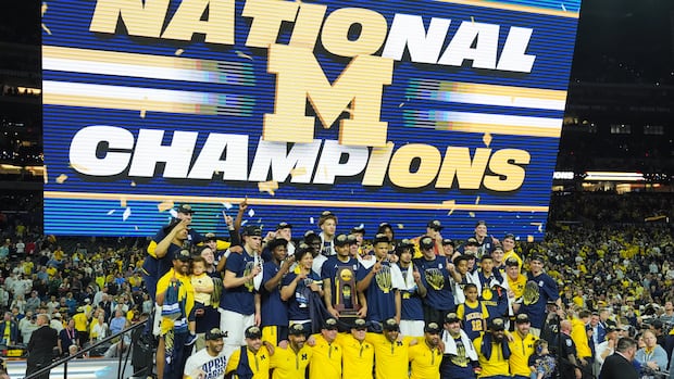 Michigan muscles its way to program’s 2nd national title, beating stubborn UConn 69-63