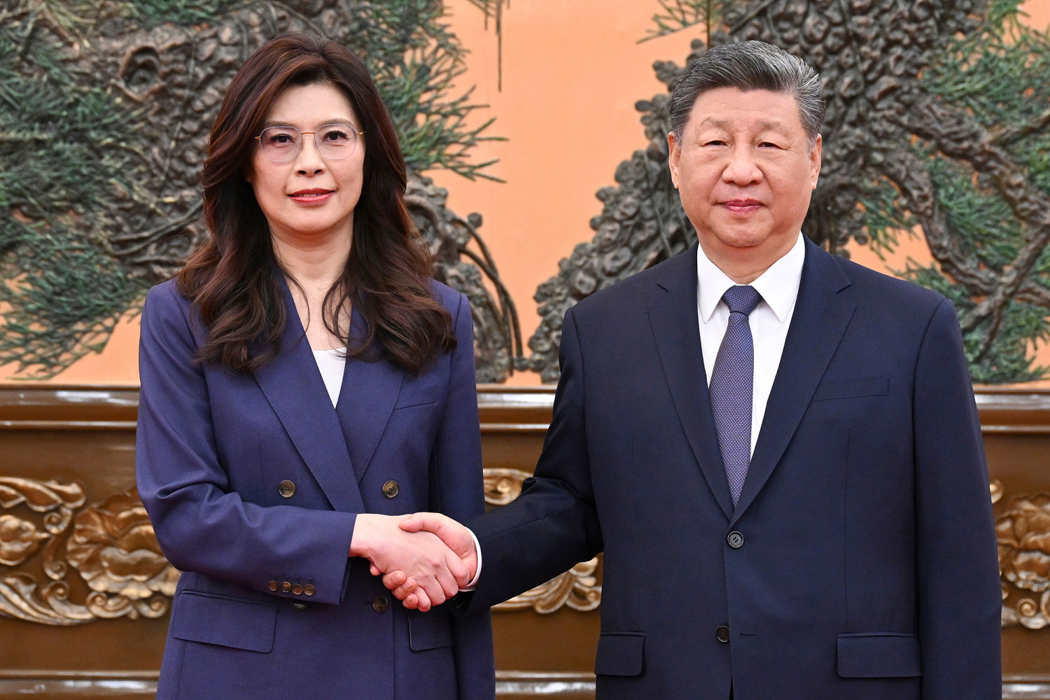China’s Xi talks peace with Taiwan’s opposition leader even as Beijing raises military pressure