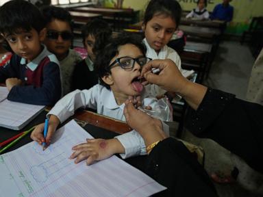 Suspected militants kill police officer assigned to guard polio team as nationwide campaign begins