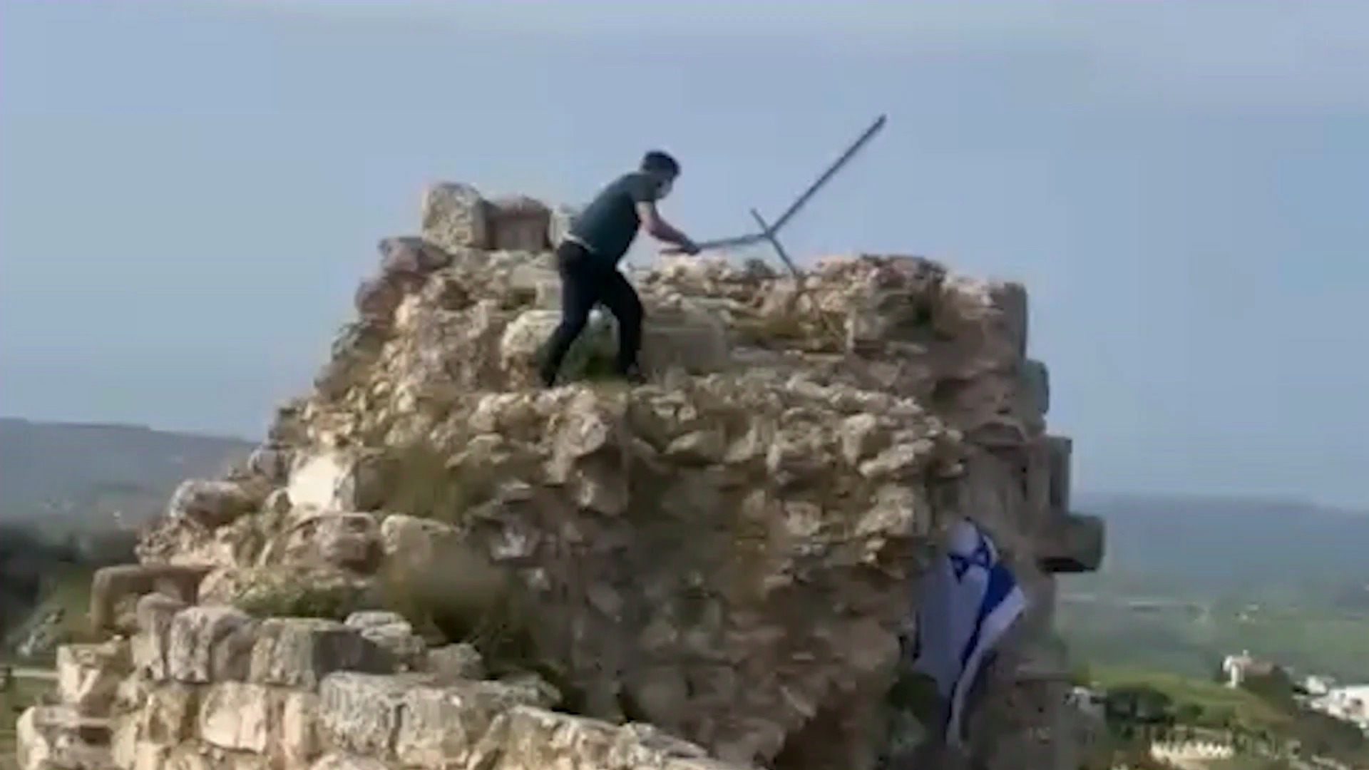 Lebanese man removes Israeli flag from castle in southern Lebanon