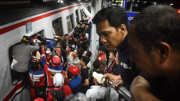 Train collision in Indonesia kills 14, injures dozens as rescuers recover last victims