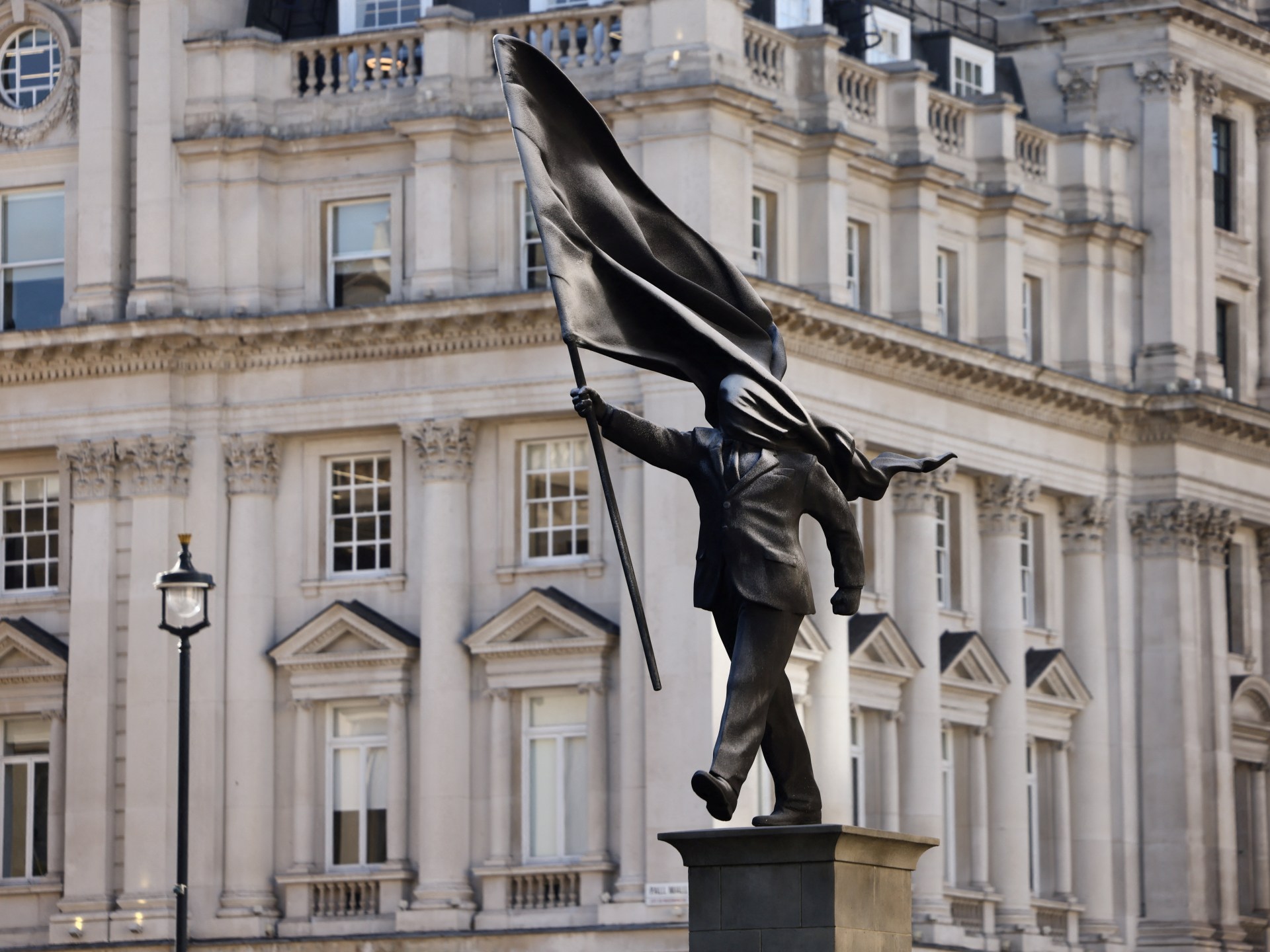 New Banksy sculpture appears to show politician blinded by his own flag