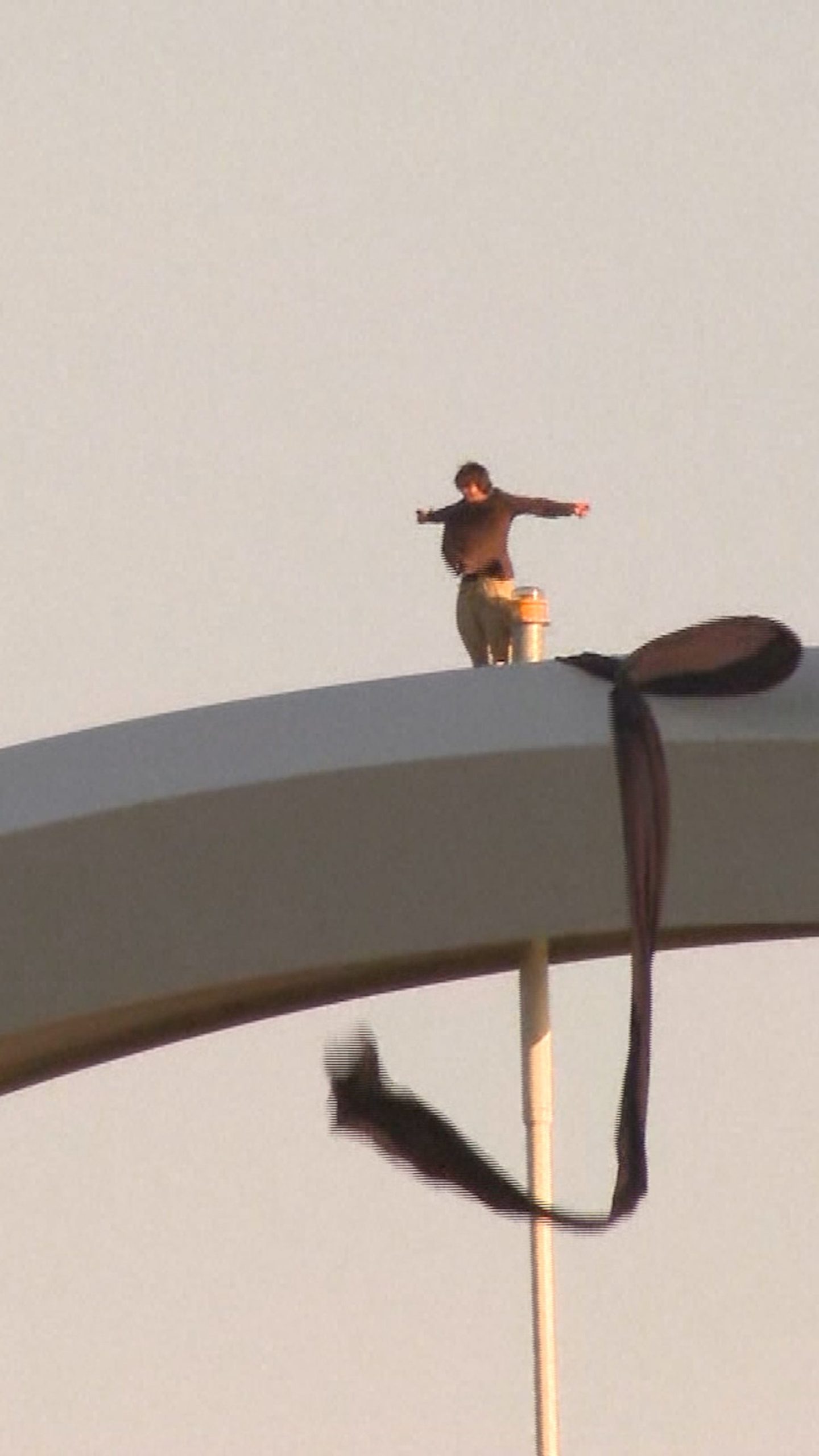 Man climbs D.C. bridge to protest Iran war
