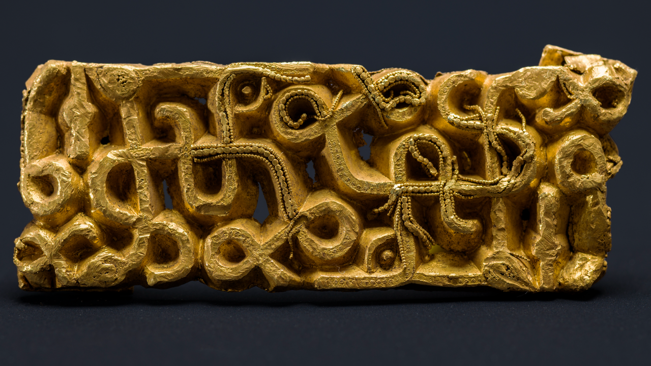 Gold sword scabbard discovered under toppled tree in Norway was likely ‘sacrificed’ by an elite warrior 1,500 years ago