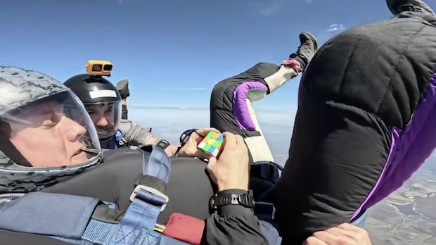 Think solving a Rubik’s Cube is hard? Try doing it while freefalling from a plane